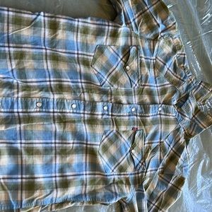 Levi’s flannel, size small, colors are green blue . Has pockets and each side